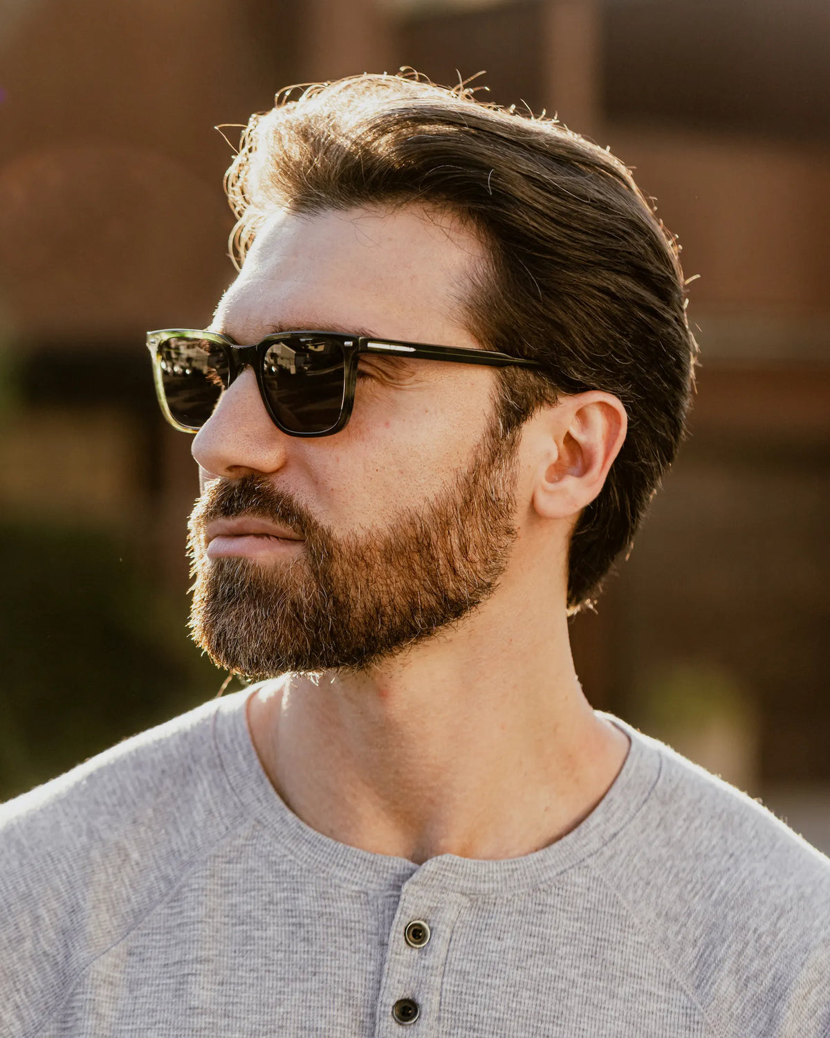 Green havana sunglasses on face