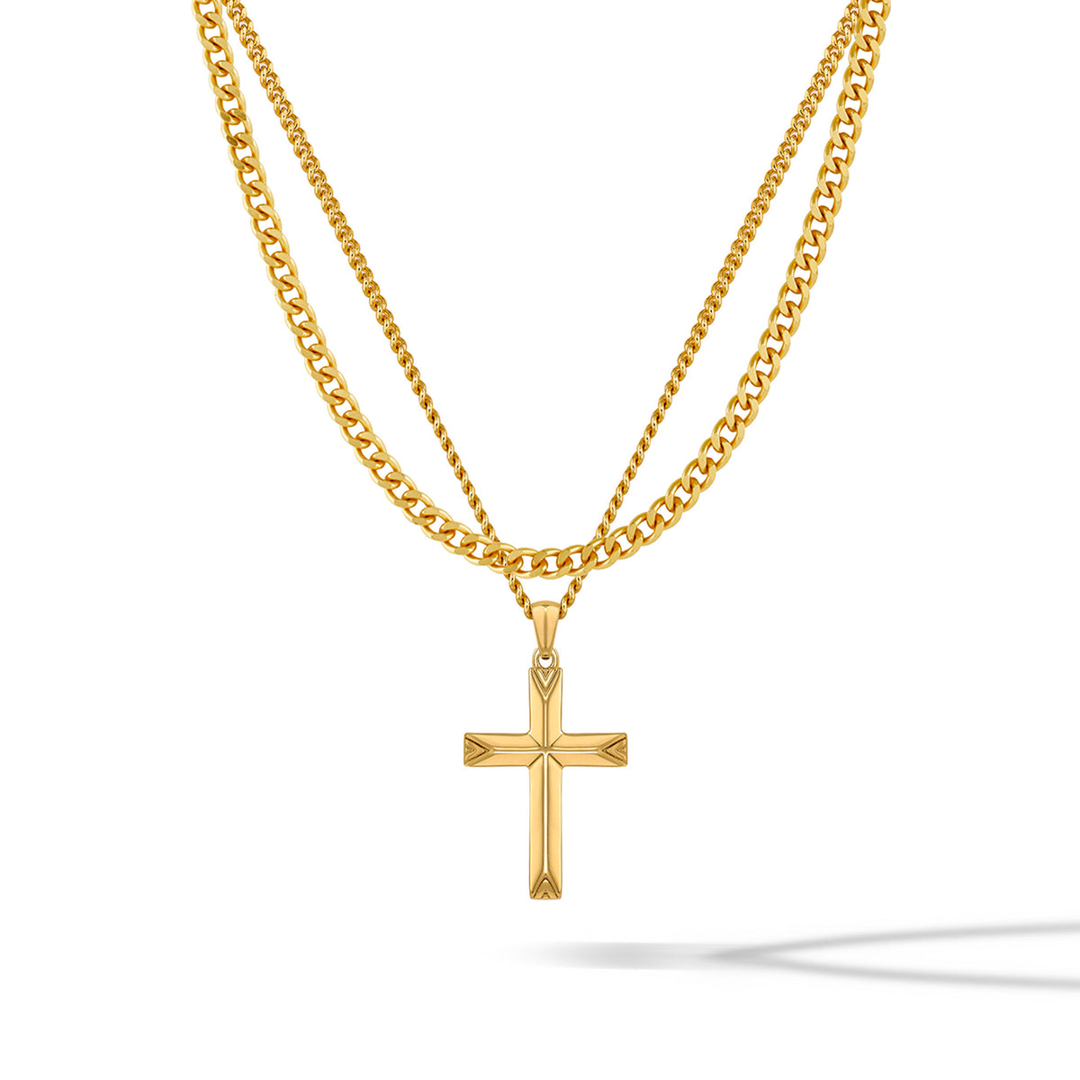 A gold-colored cross pendant hanging on a gold-colored chain against a white background.