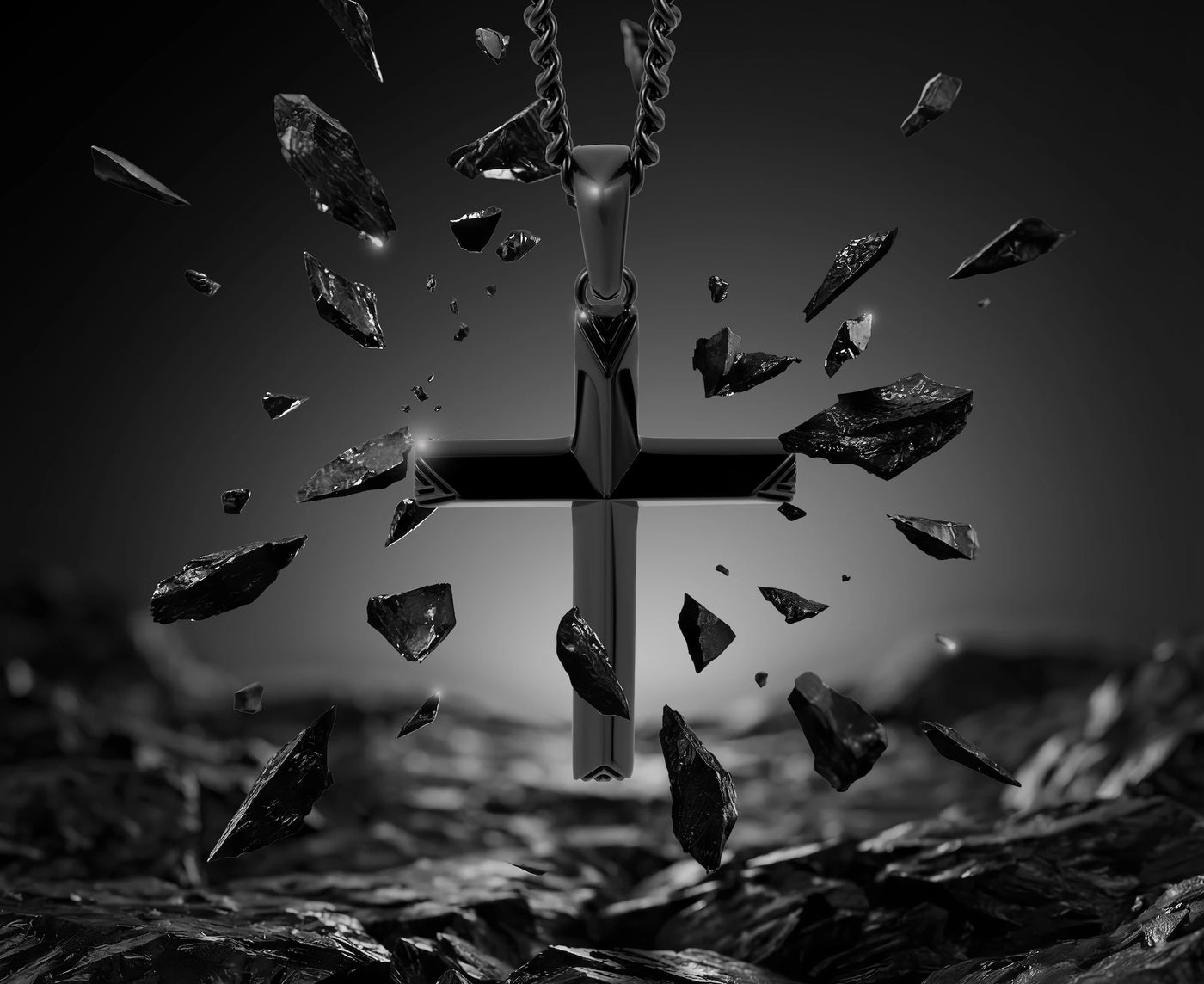 Black cross pendant with shattered glass pieces on a dark background