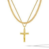 Gold chain necklace with a cross pendant on a white background