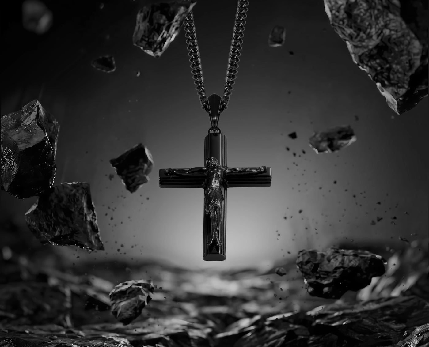 Cross pendant with chain against a dark, rocky background