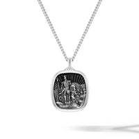 Silver pendant necklace with detailed design on a white background