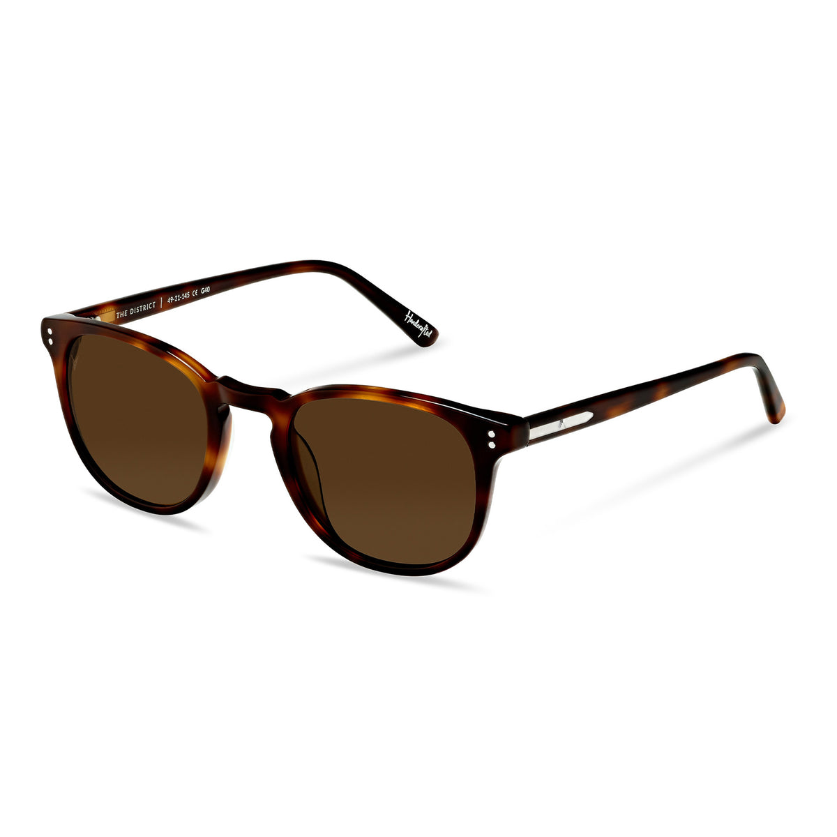 Sunglasses with tortoiseshell frame and brown lenses on a white background