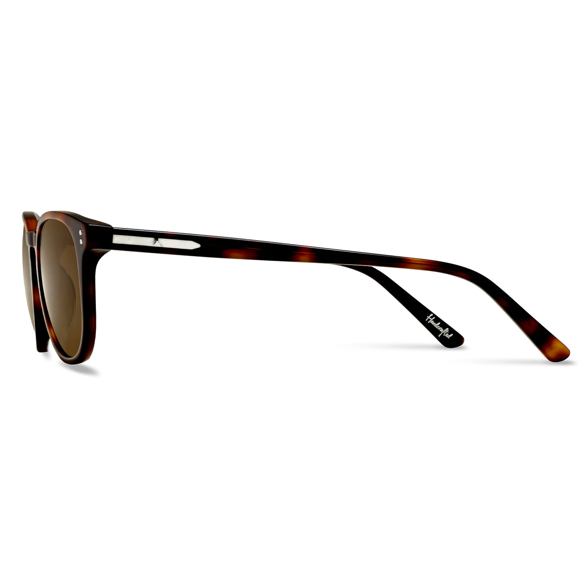 Sunglasses with tortoiseshell frame and brown lenses on a white background