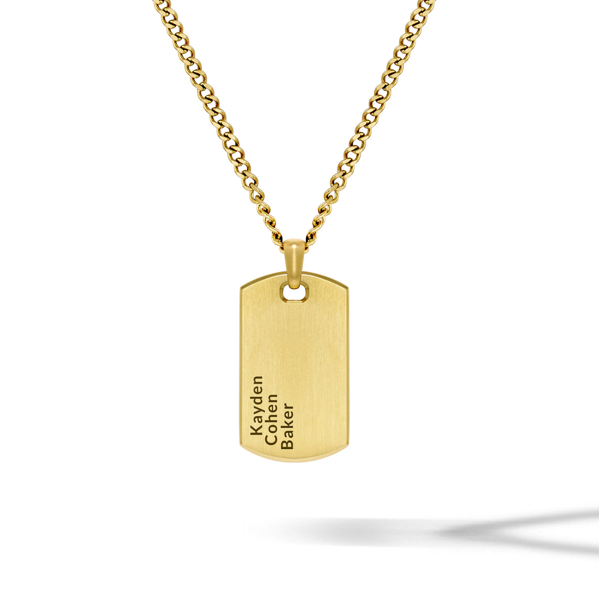 Gold necklace with a dog tag pendant on a white background