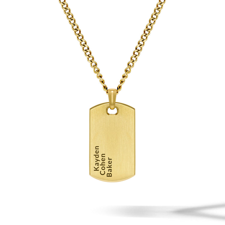 Gold necklace with a dog tag pendant on a white background