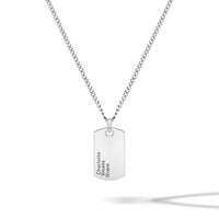 Silver necklace with a dog tag on a white background