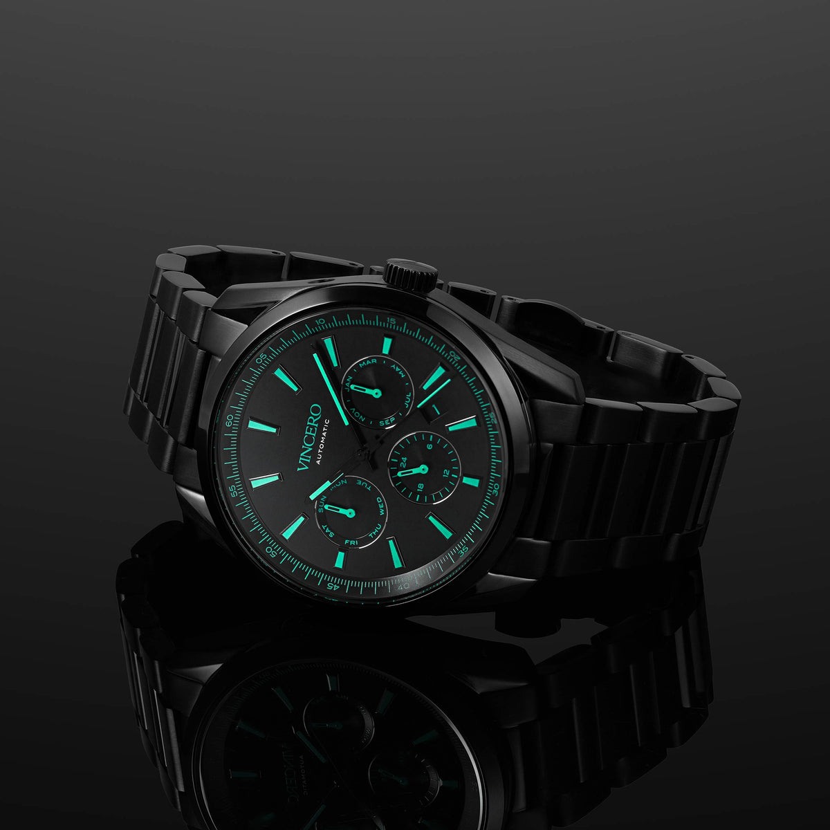 Black wristwatch with green glowing face on a BLACK background for men