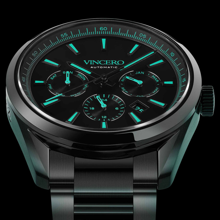 Black wristwatch with green glowing face on a BLACK background