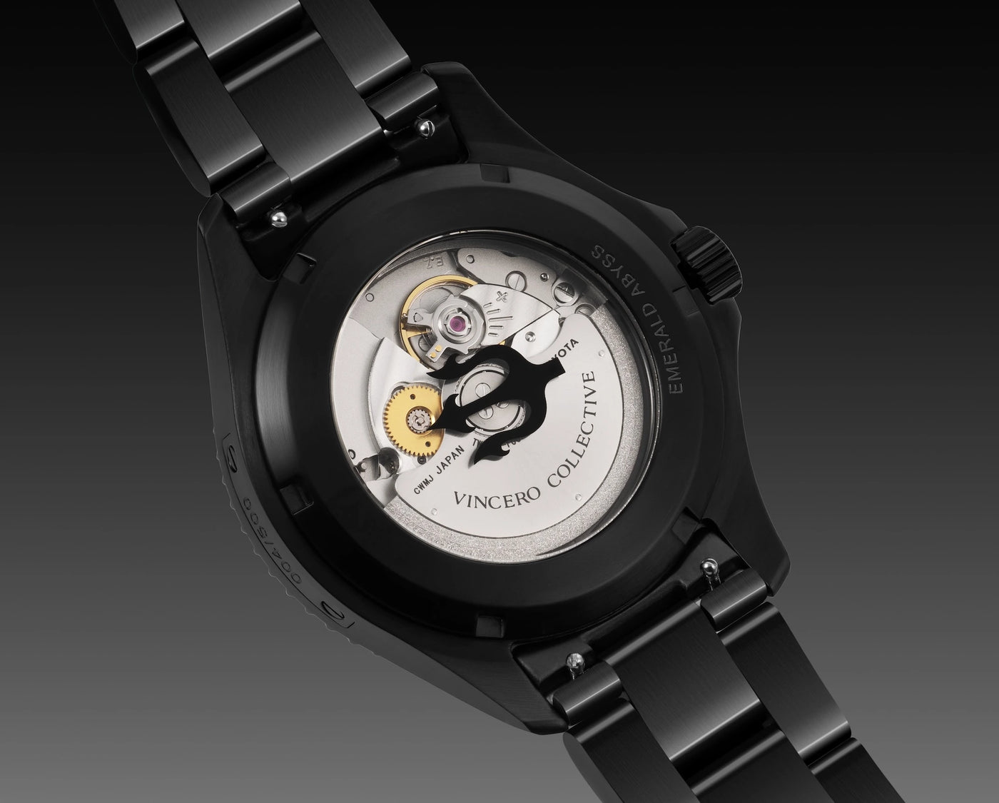 Black wristwatch with visible mechanical components on a dark background