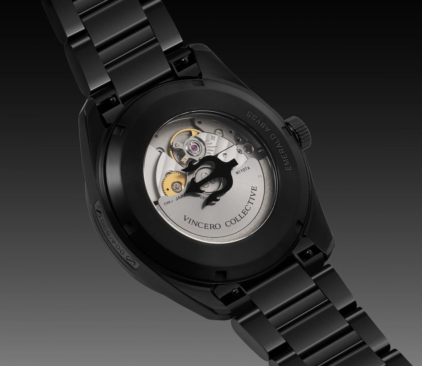 Black watch with visible mechanical components on a dark background