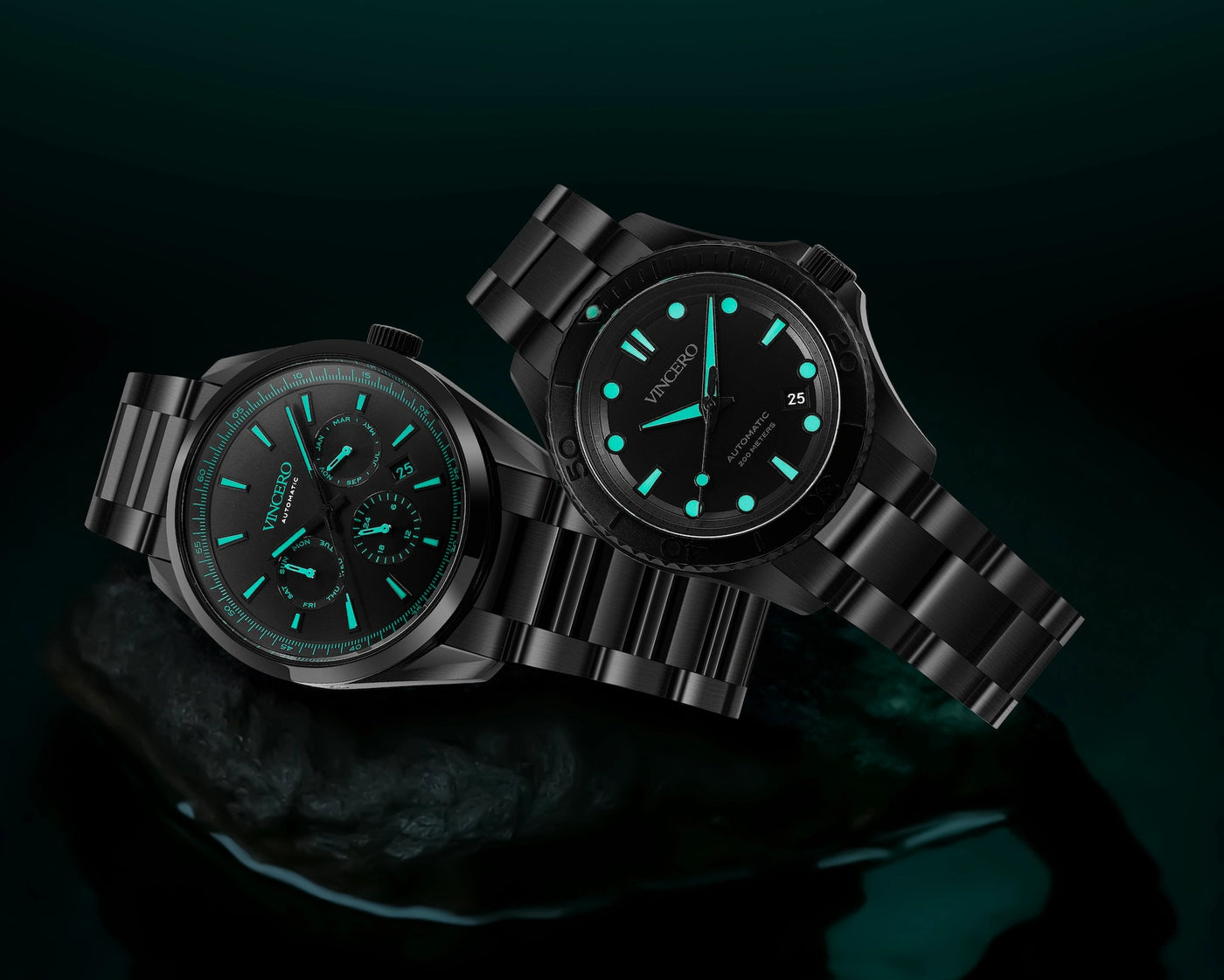 Two black watches with green glowing faces on a dark background