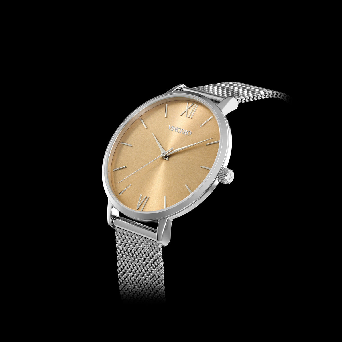 Silver watch with gold face on a black background