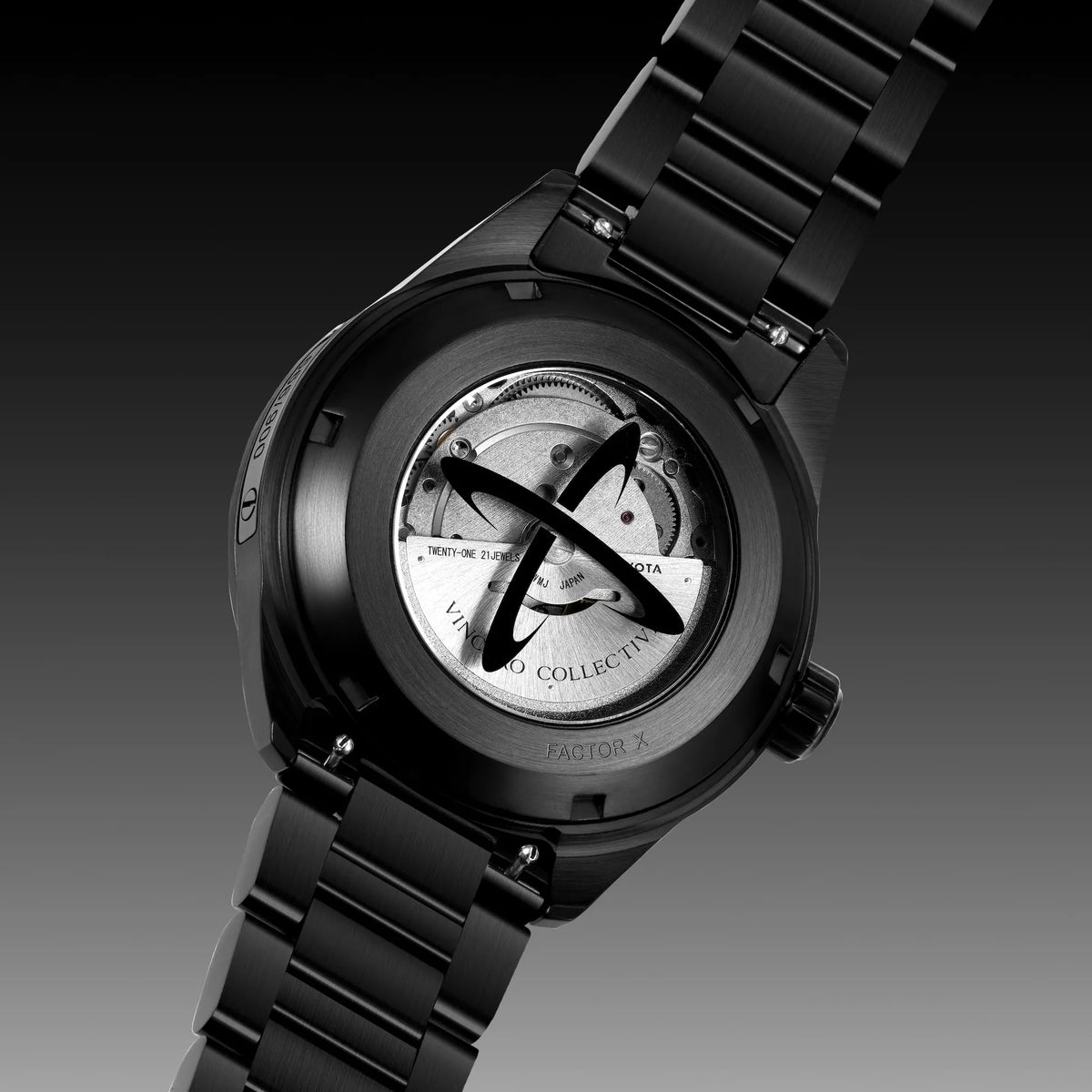Black watch with visible mechanism on a dark background