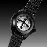 Black watch with visible mechanism on a dark background
