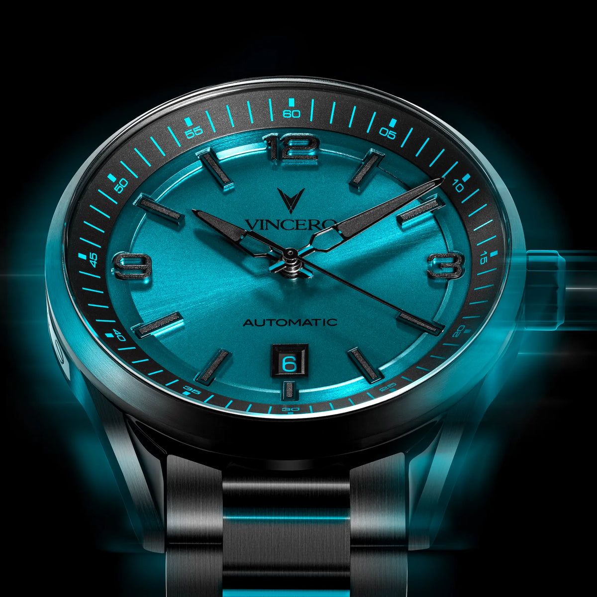 Luxury watch with blue face and black strap on a dark background
