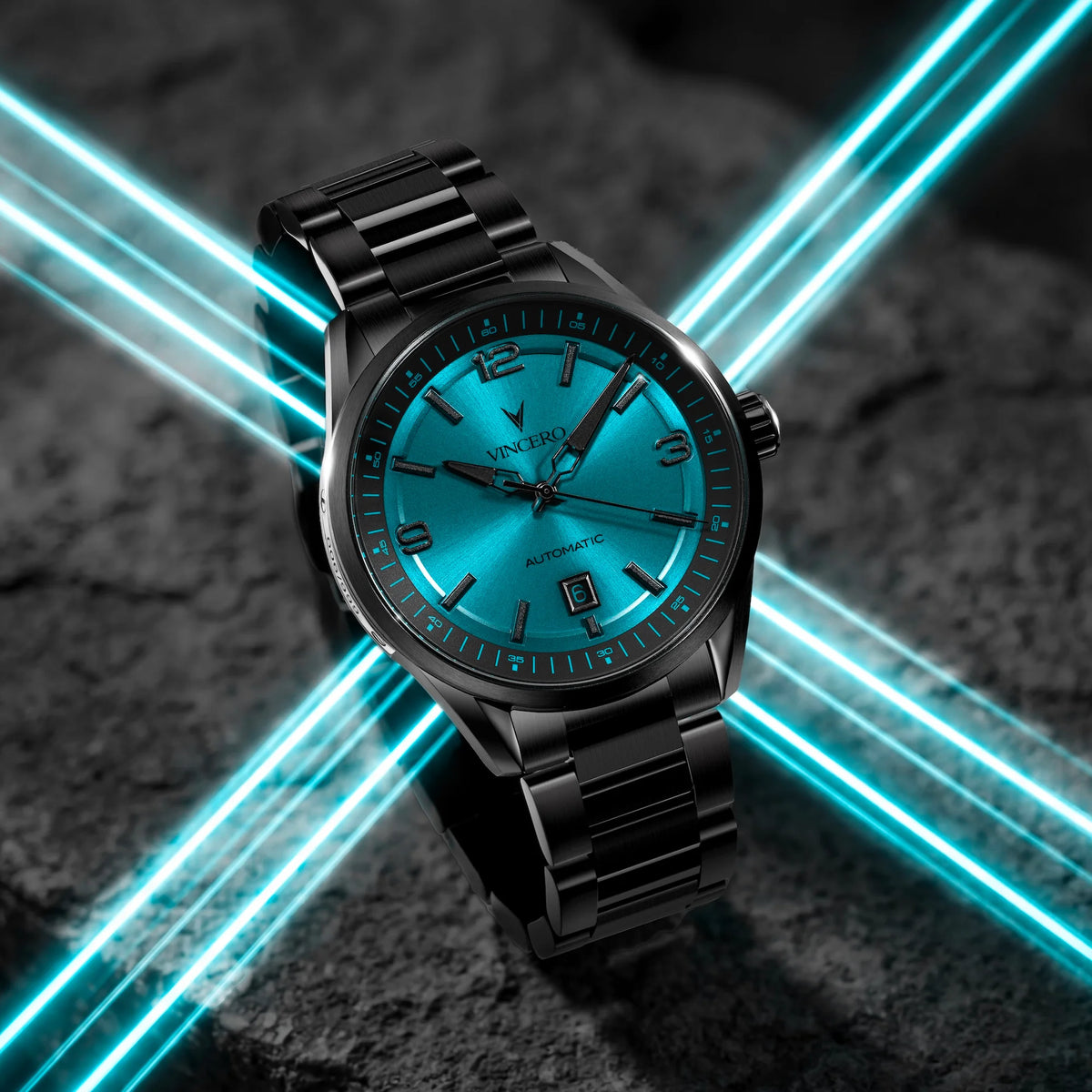 Black wristwatch with blue face on a dark surface with blue light effects