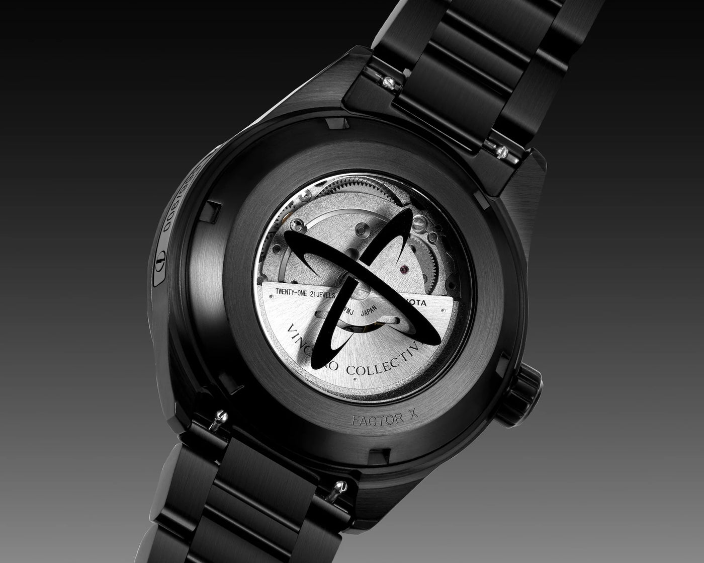 Black watch with visible mechanical components on a dark background