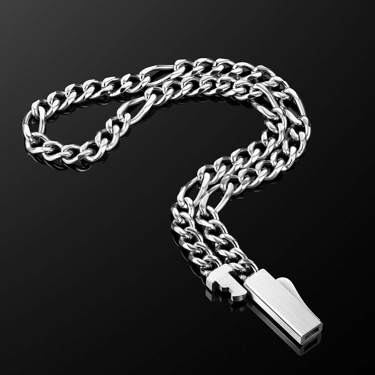 A silver-toned metal chain necklace with a rectangular pendant, displayed on a reflective black background.