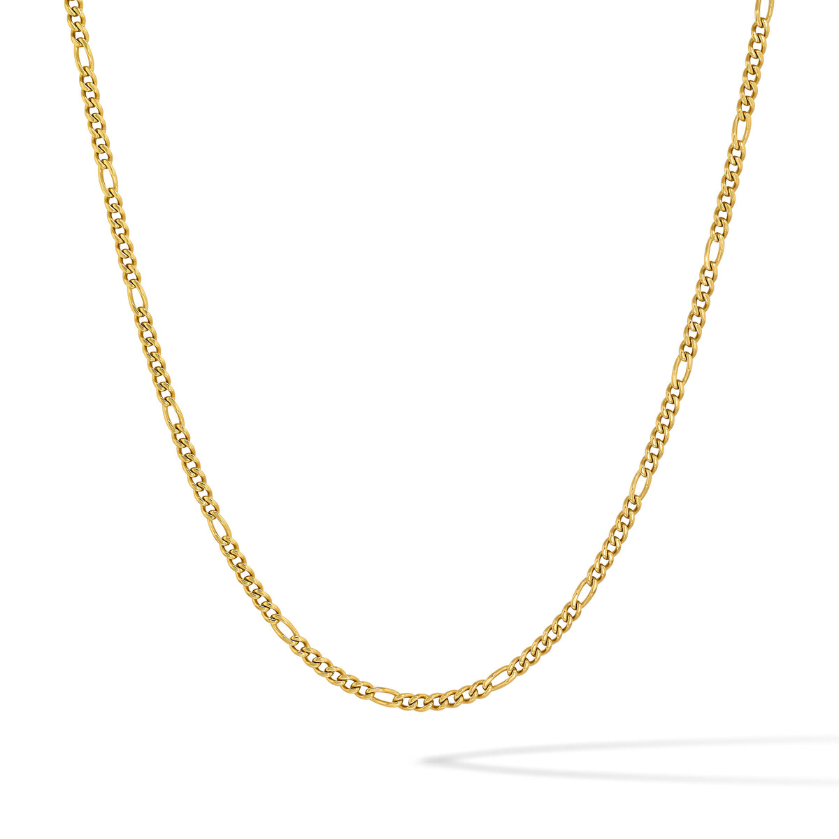 A gold Figaro chain necklace displayed in a curved drape against a clean white background.