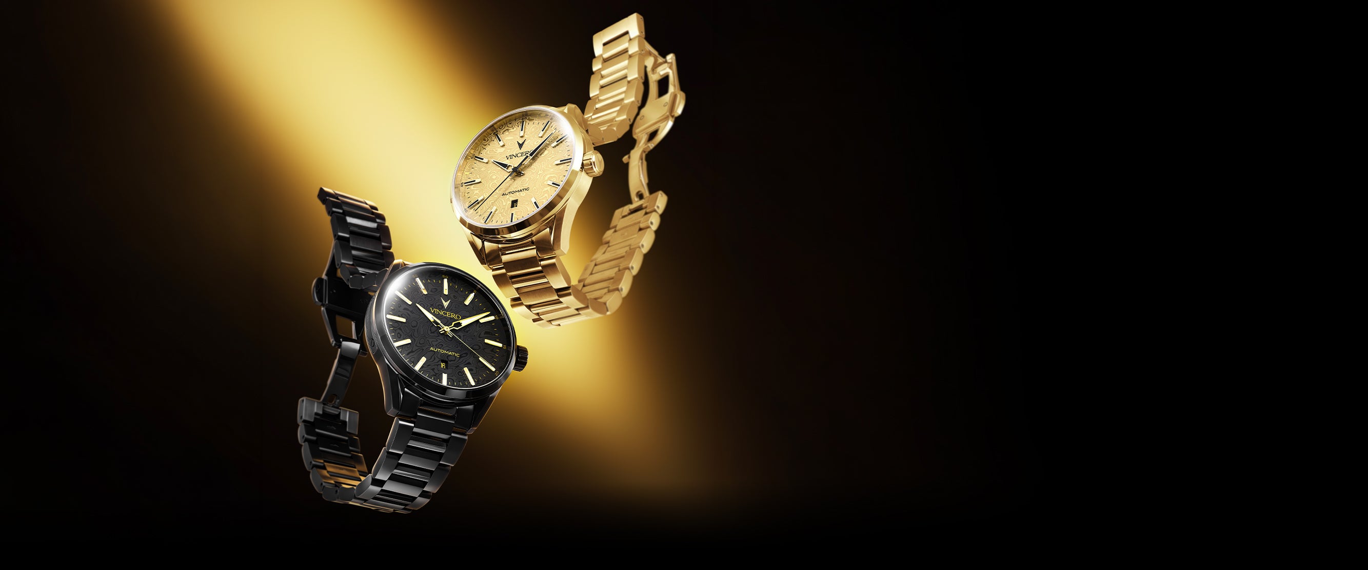 Two luxury wristwatches floating against a dark background with a dramatic gold spotlight. One watch has a black case and black dial with a black metal bracelet, while the other has a gold case, gold dial, and gold metal bracelet.
