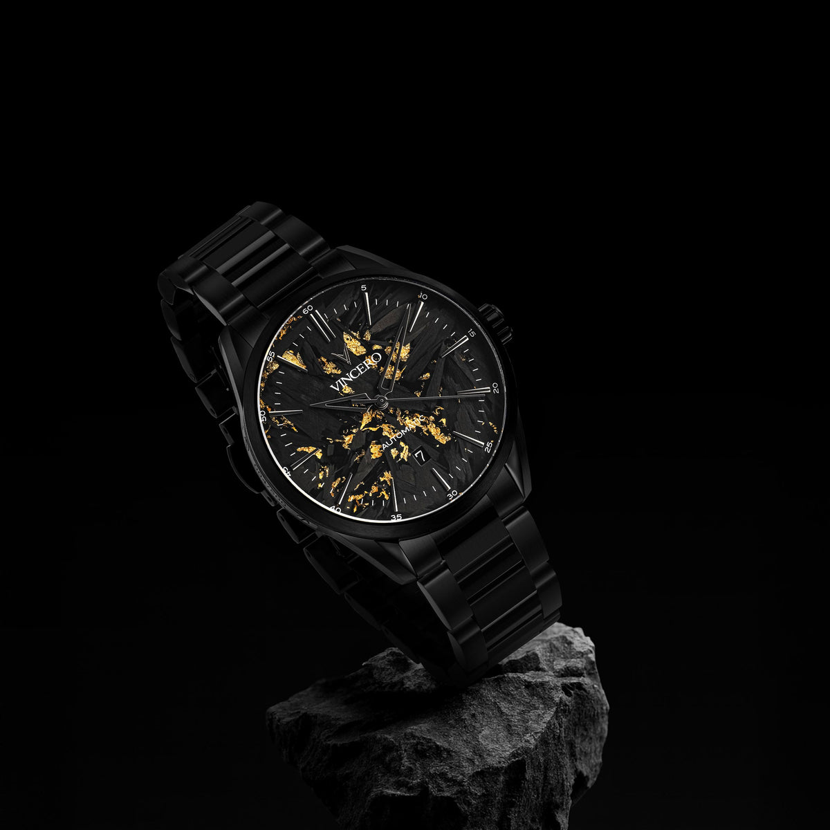 Black wristwatch with a unique face design on a dark background
