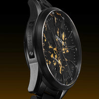 Luxury watch with black and gold design on a dark background