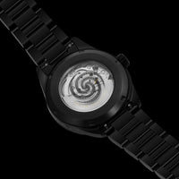 Black watch with a detailed mechanical inner mechanism on a black background