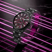Black wristwatch with a red face on a dark background with pink neon lines