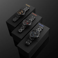 Three black wristwatches on black boxes with 'Vincero' branding against a dark background