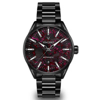Black wristwatch with red speckled face on a white background