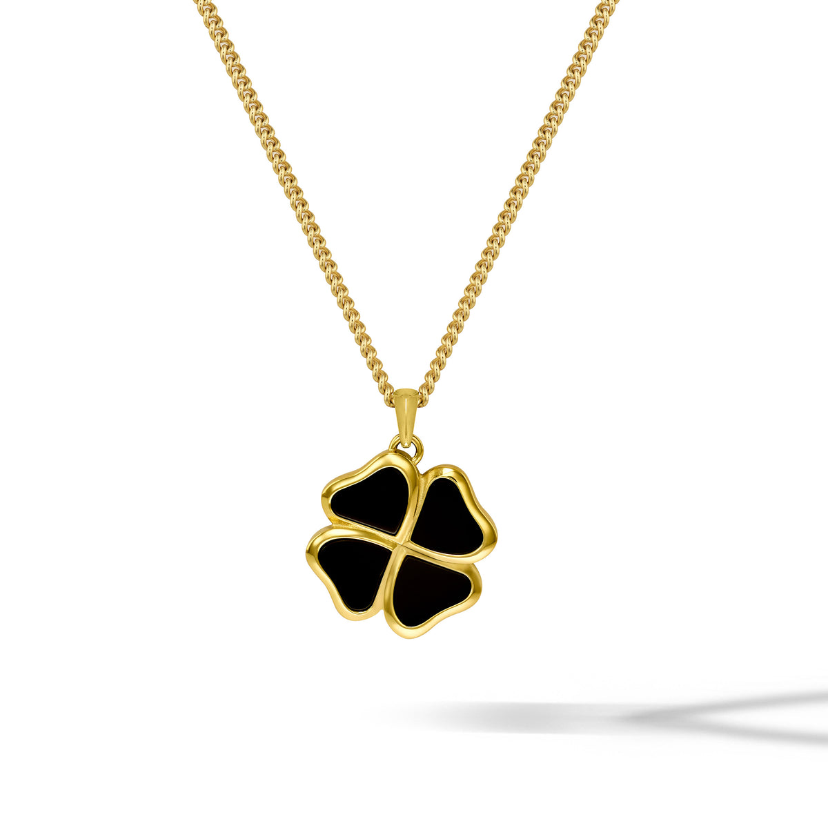 Gold necklace with a black clover-shaped pendant on a white background