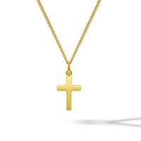Gold cross pendant on a white background