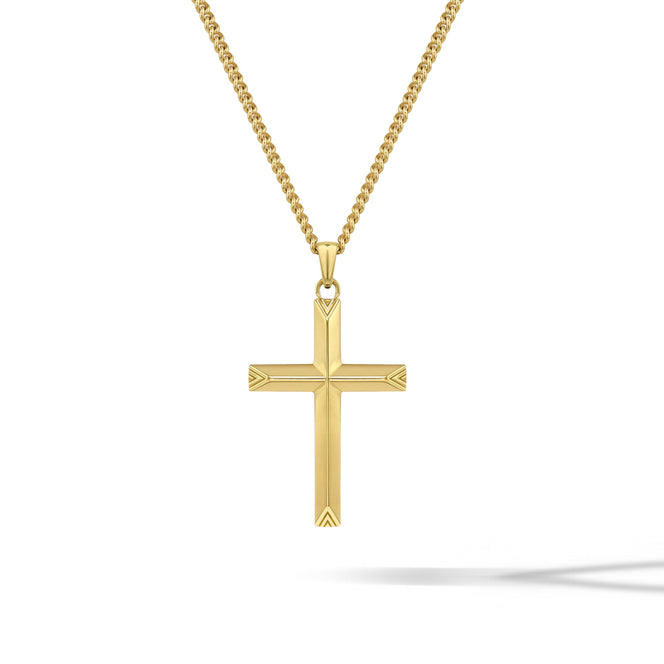 Gold cross pendant on a chain against a white background