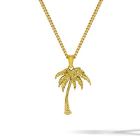 Gold palm tree necklace on a white background