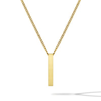 Gold necklace with a vertical bar pendant on a white background