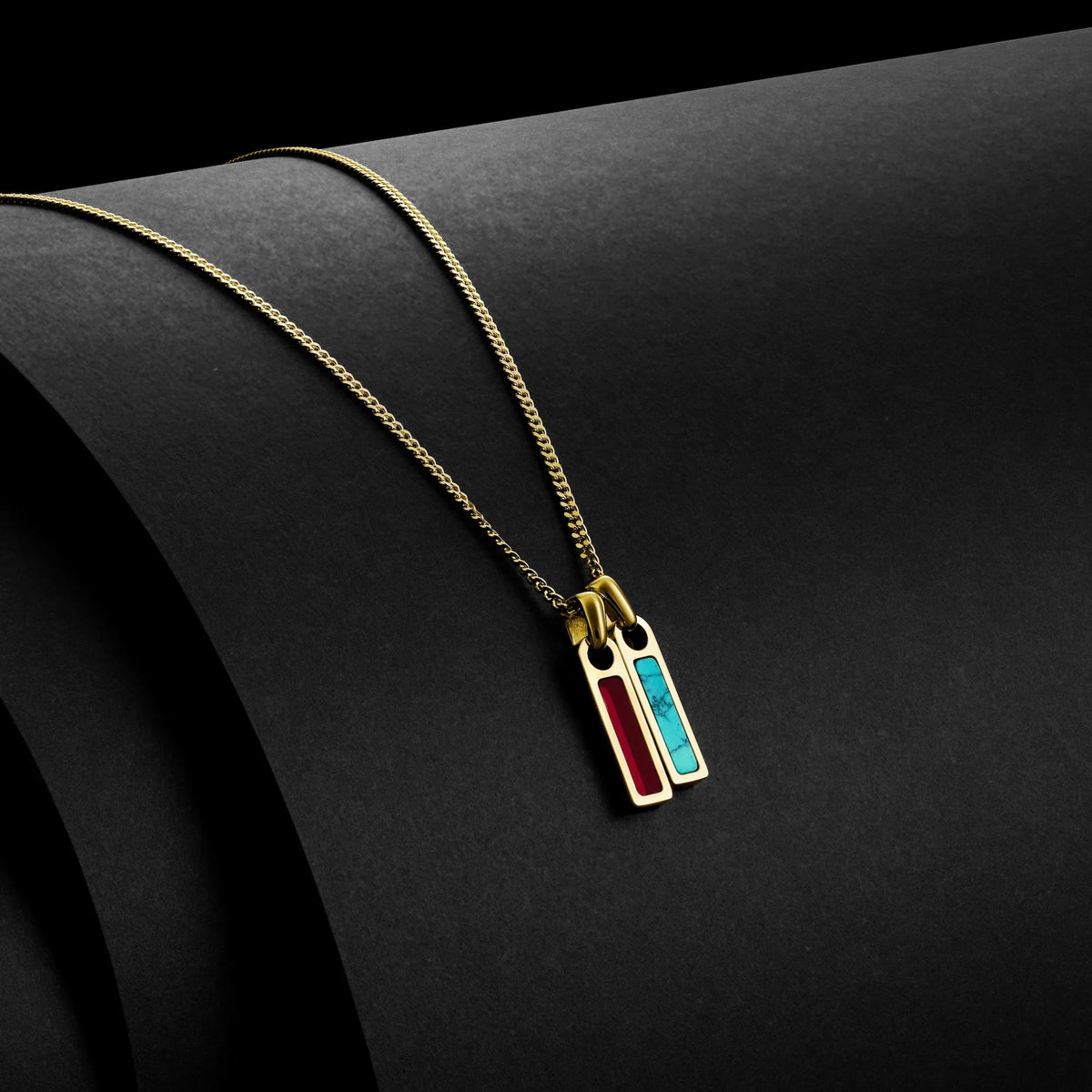 Necklace with a colorful pendant on a black background