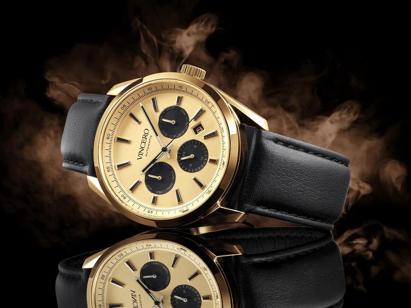 Gold wristwatch with black leather strap on a dark background