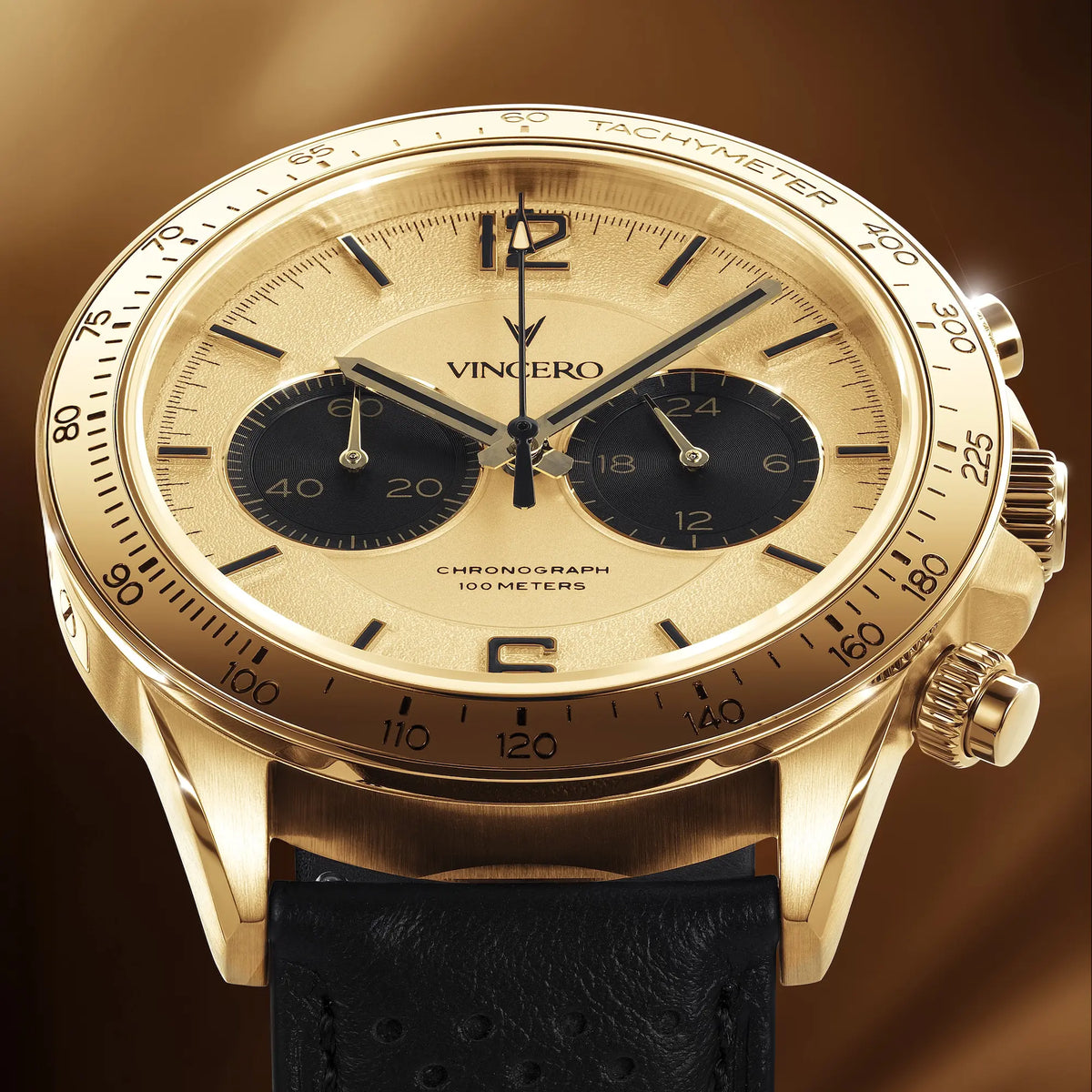 Gold wristwatch with black strap on a brown background