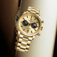 Gold wristwatch with a detailed face on a gradient background