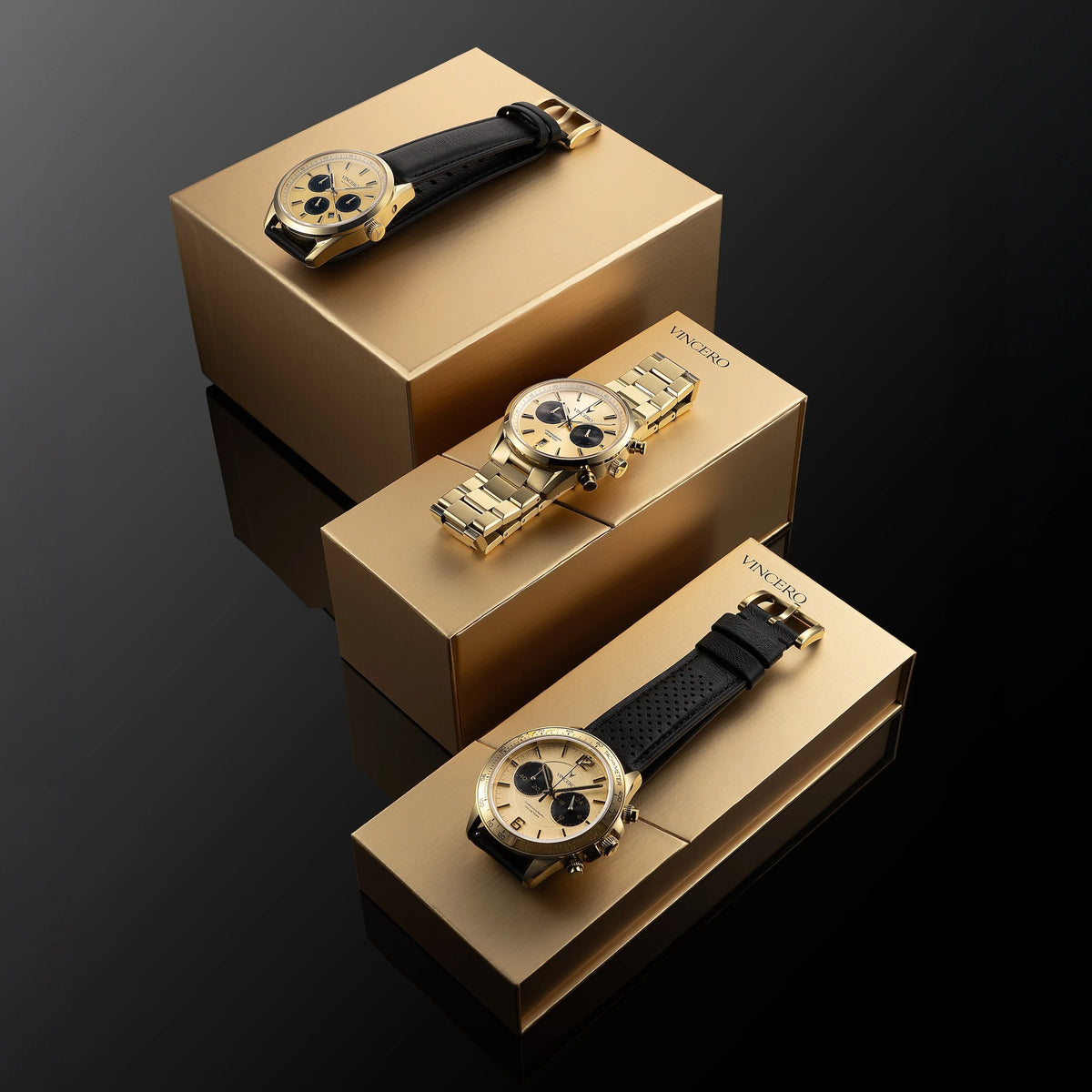 Gold watch with black strap on a gold box against a dark background