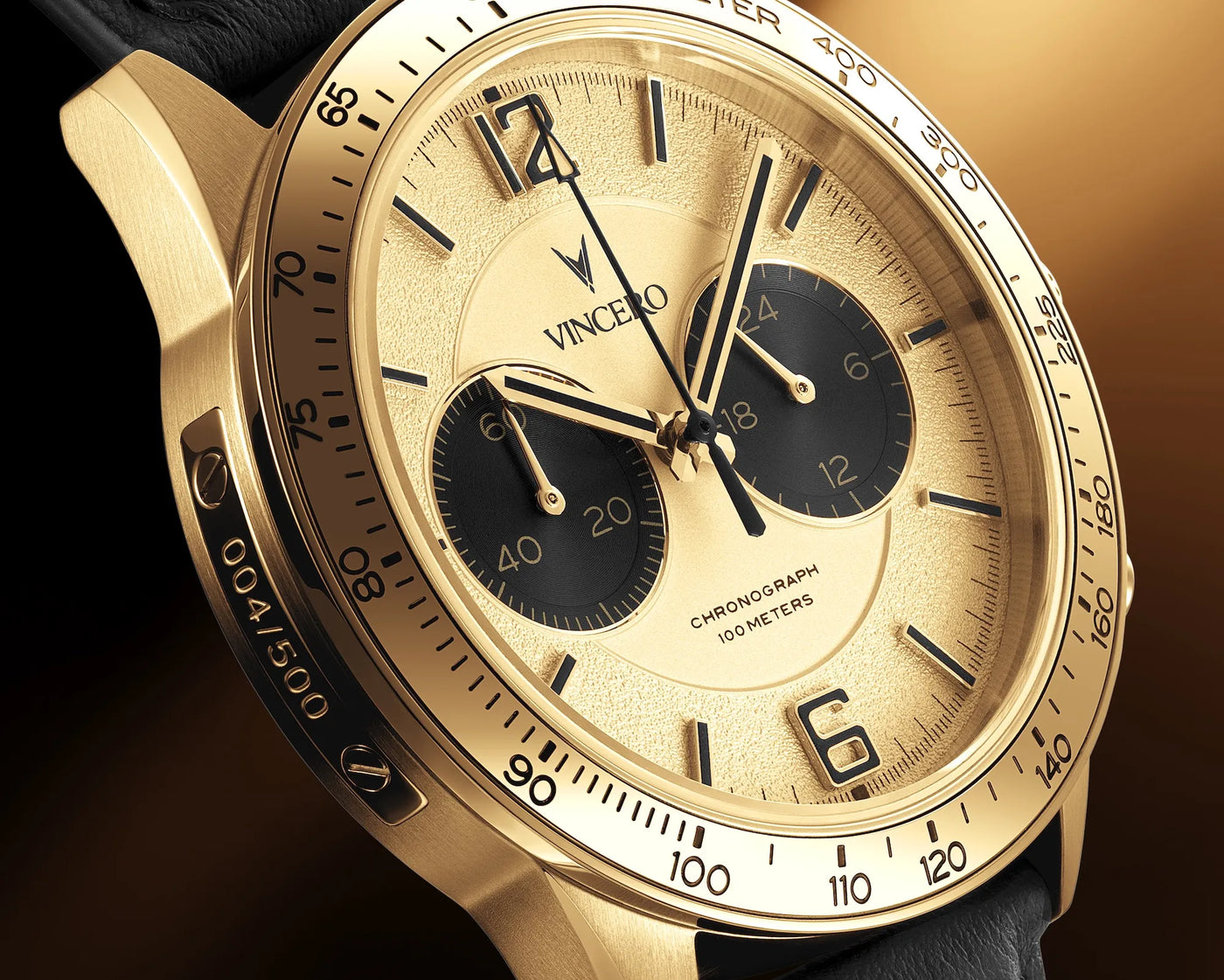 Gold wristwatch with black face on a dark background