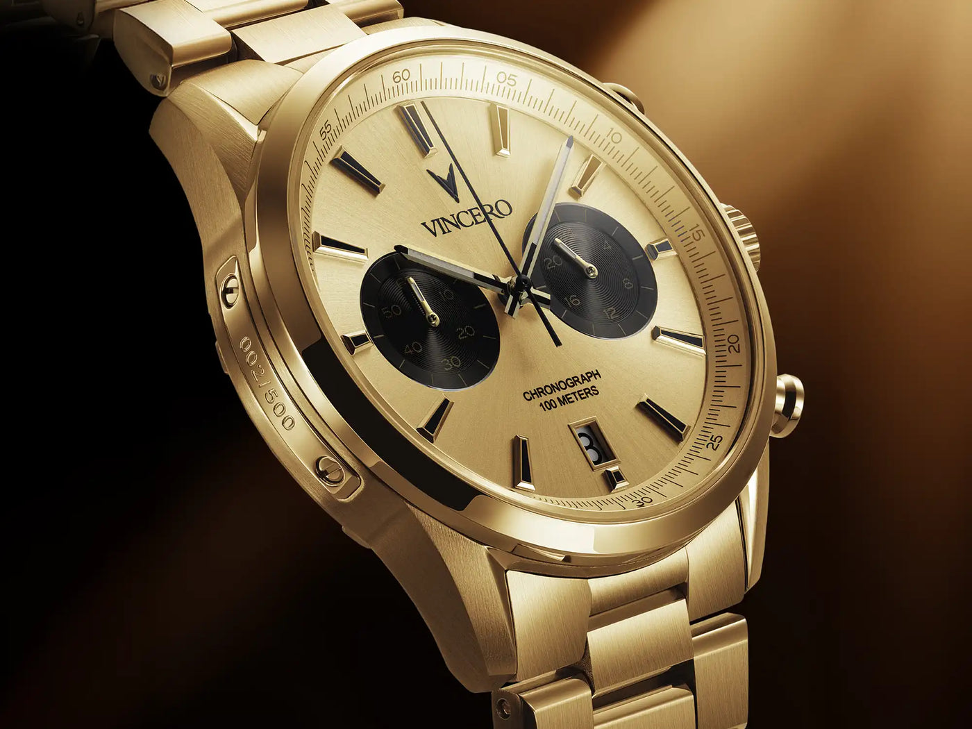 Gold wristwatch with a detailed face on a dark background