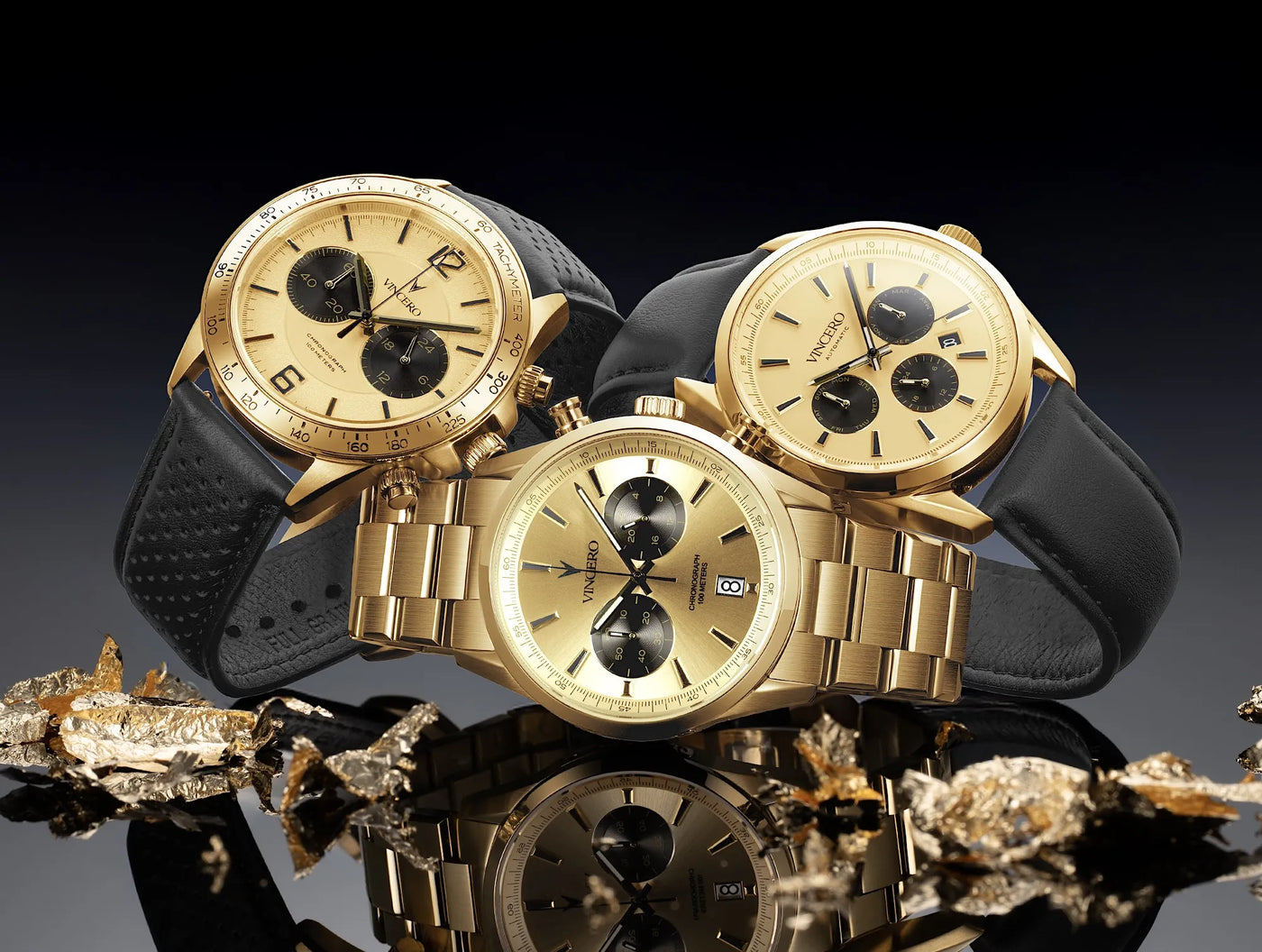 Three gold watches with black straps on a reflective surface with a dark background