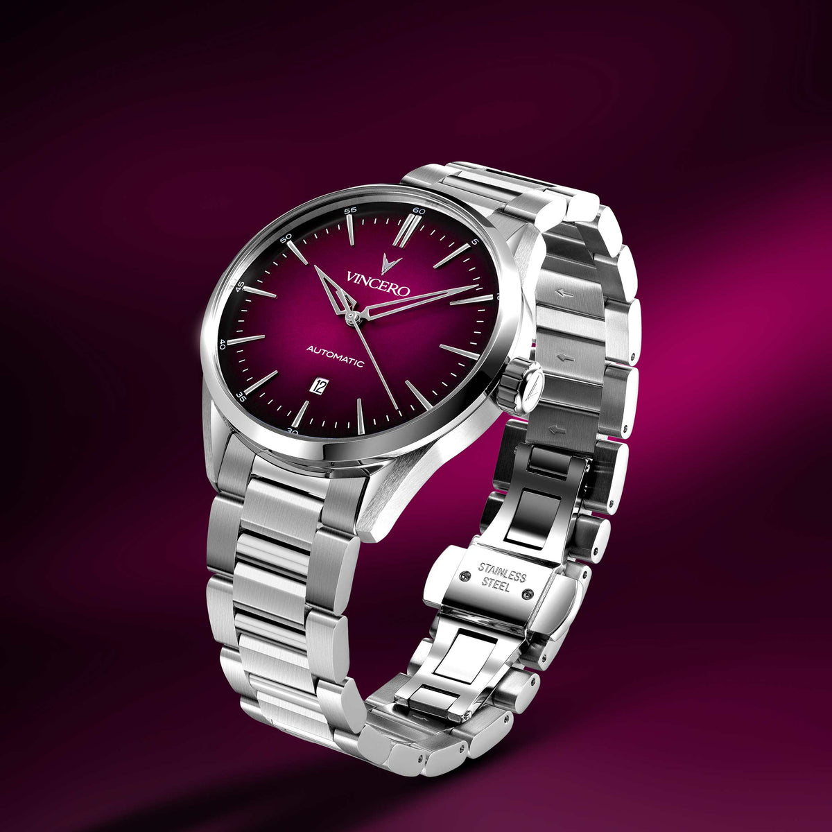 Silver watch with a purple face on a purple background
