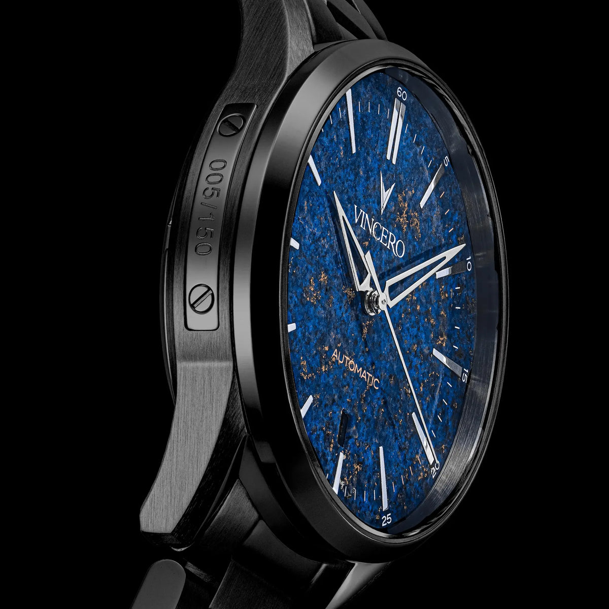 Luxury watch with blue face and black case on a black background
