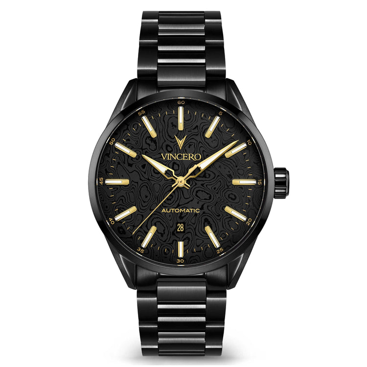 A black automatic wristwatch with a matching black metal link bracelet, featuring a textured black dial with gold-tone hands, hour markers, and the VINCERO brand name.