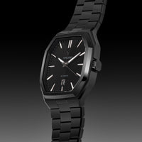 Black wristwatch with a dark background