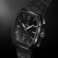Black wristwatch with 'Vincero' brand on a dark background