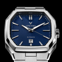 Silver wristwatch with blue dial on a black background